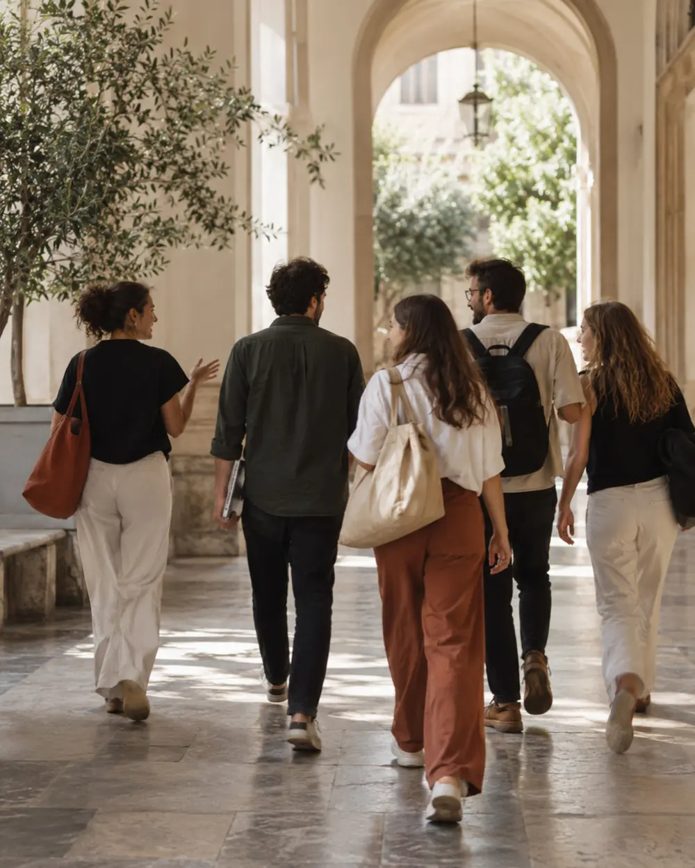The collective walking together mid conversation